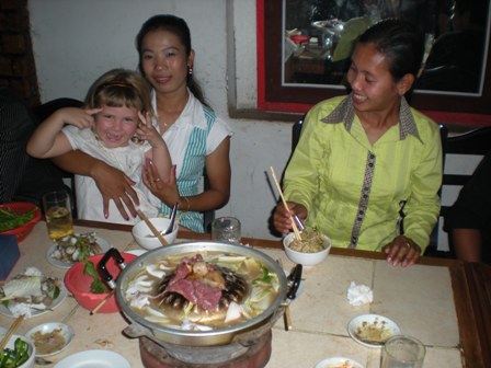 Callie decided Mom made the best food so she sat with her and Hong