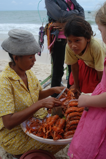 Callie buying $1 lobster in Sihanoukville