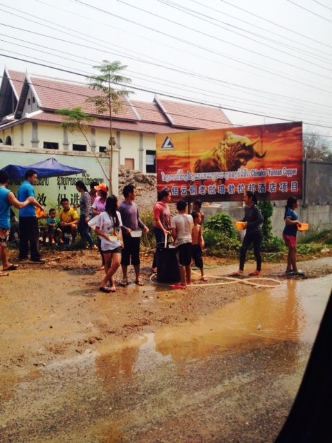 Local people enjoying traditional water celebrations for Pi Mai.